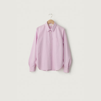 Pink shirt on a hanger against a white background