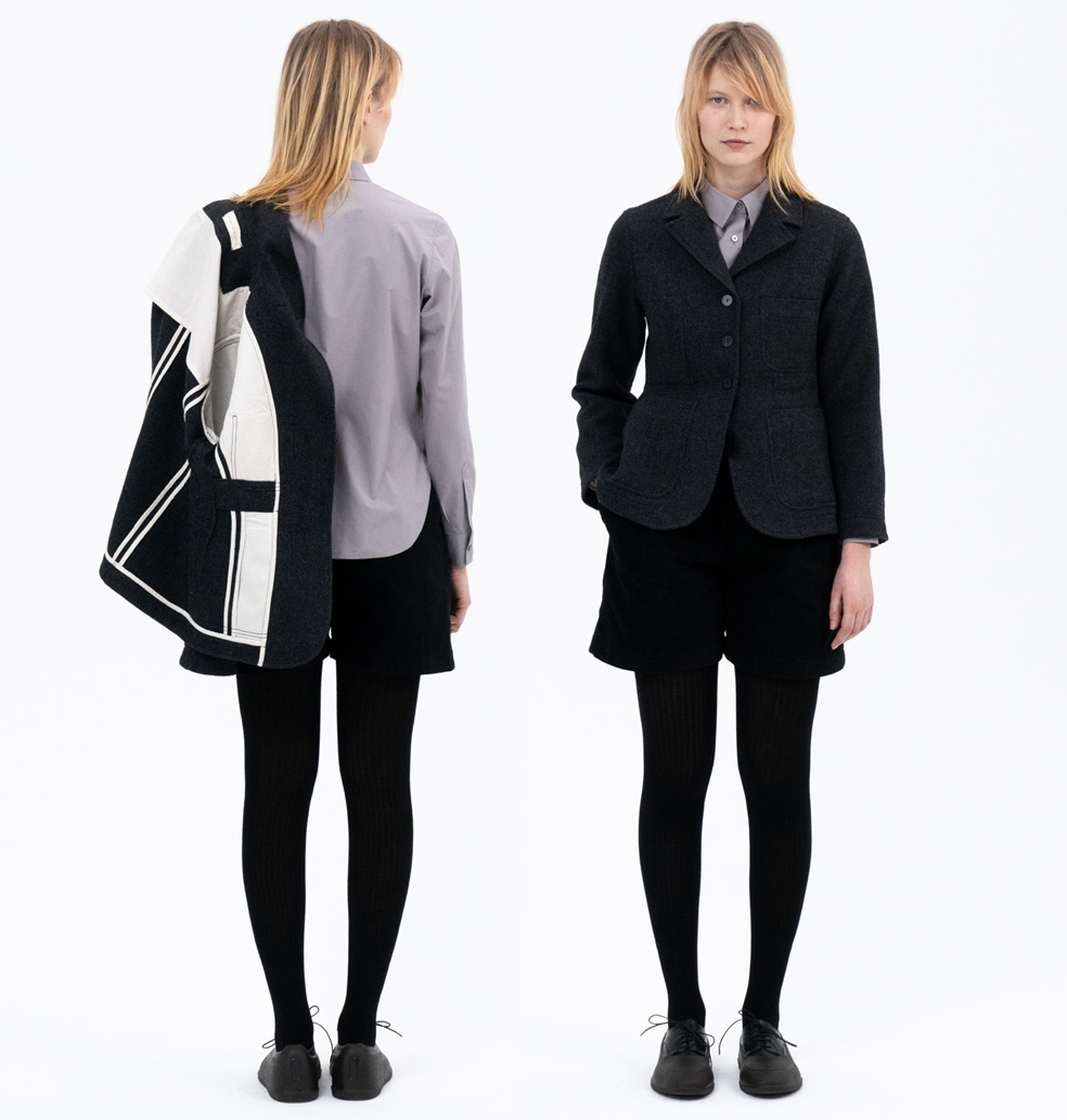 Two people wearing black jackets, one facing forward and one facing backward, on a white background.